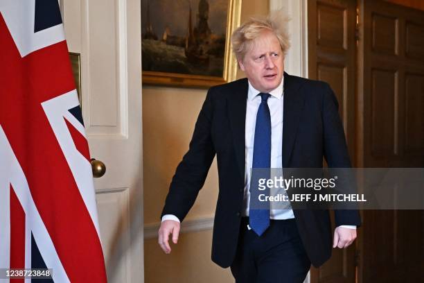 Britain's Prime Minister Boris Johnson arrives to give an address to the nation on Russia's invasion of Ukraine, speaks from 10 Downing Street, in...