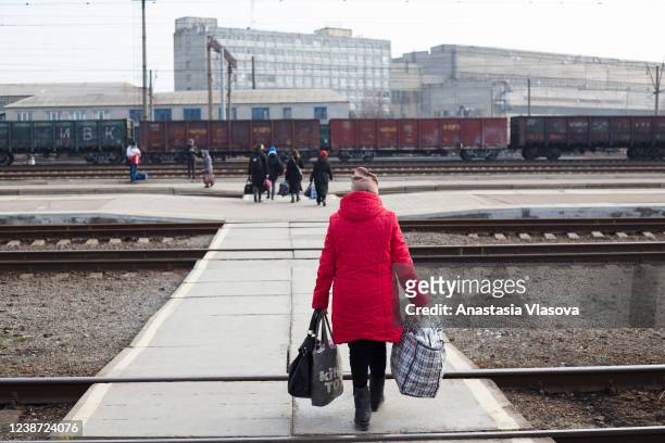 People walk through the railway tracks on February 24, 2022 in Kramatorsk, Ukraine. Overnight, Russia began a large-scale attack on Ukraine, with...