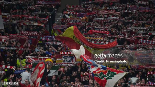 Atletico de Madrid fan with scarves on the stands during the UEFA Champions League match, round of 16 between Atletico de Madrid and Manchester...