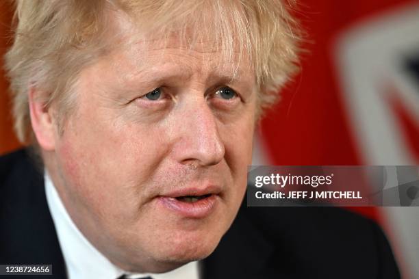 Britain's Prime Minister Boris Johnson speaks from 10 Downing Street, in London, on February 24, 2022 during an address to the nation on Russia's...