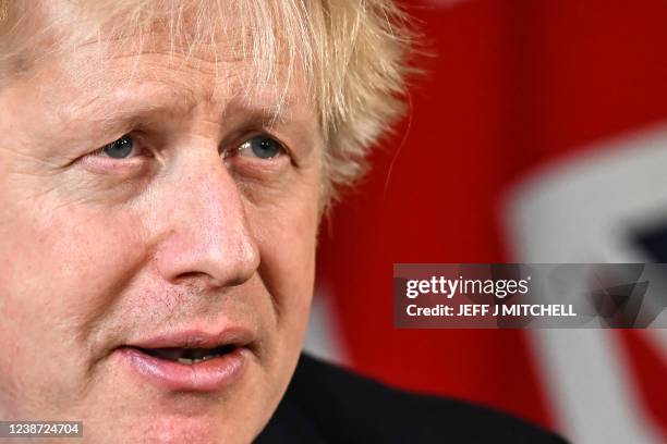 Britain's Prime Minister Boris Johnson speaks from 10 Downing Street, in London, on February 24, 2022 during an address to the nation on Russia's...