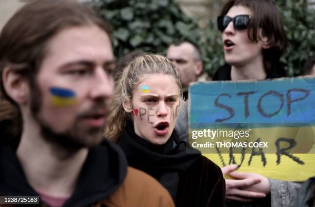 Ukrainian citizens protest against Russia's military operation in Ukraine in front of the Russian embassy in Paris on February 24, 2022. - Russia has...