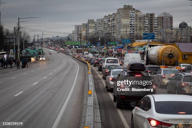 Truck drivers and residents seeking to leave the capital in a traffic jam in Kyiv, Ukraine, on Thursday, Feb. 24, 2022. Russian forces attacked...