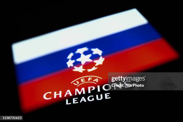 Champions League logo displayed on a phone screen and Russian flag displayed on a phone screen are seen in this multiple exposure illustration photo...