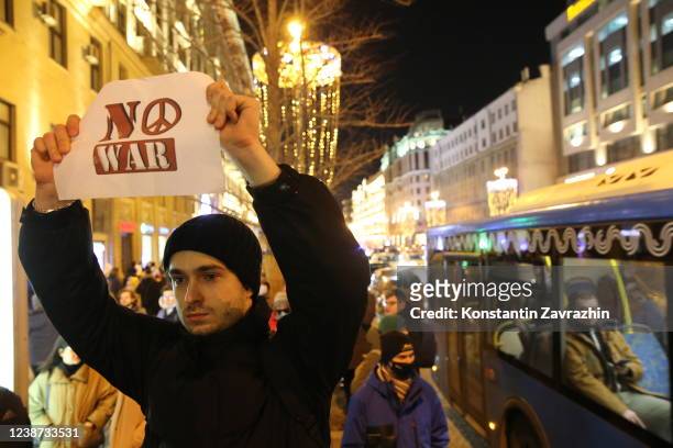 Man holds a placard reading "No war" during a protest at Pushkinskaya Square on February 24, 2022 in Moscow, Russia. Overnight, Russia began a...