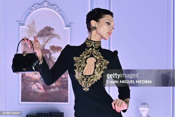 Model Bella Hadid presents a creation during the Moschino catwalk show for the Fall/Winter 2022/2023 collection on the third day of the Milan Fashion...