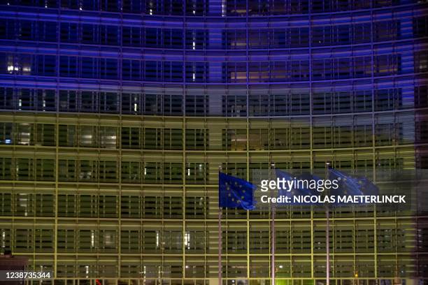 Illustration picture shows European flags fly in front of the Berlaymont building, housing the European Commission headquarters, that has been...