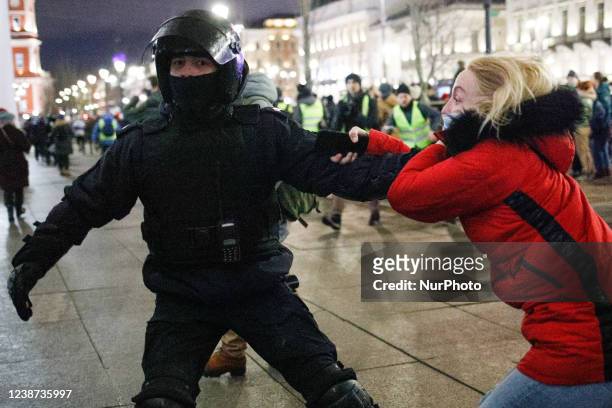 Police officers detain a protester against military actions in Ukraine. Saint Petersburg, Russia. February 24, 2022