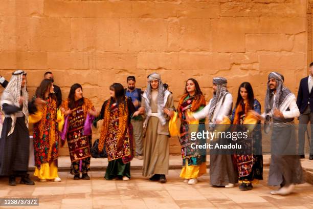 People attend the opening ceremony of the ancient city of Hatra, which was inscribed in the list of world heritage sites by UNESCO in 1985. Located...