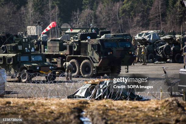 Military trucks are seen at the military camp at Arlamow airport. American soldiers arrived in Poland after Pentagon announced additional forces...