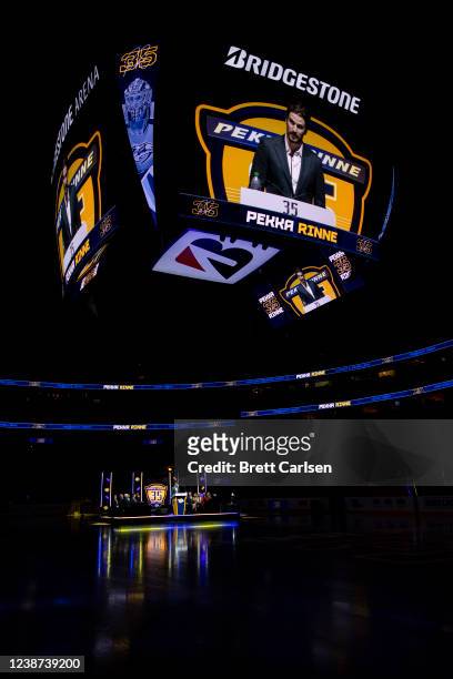 Roman Josi of the Nashville Predators speaks during a ceremony to retire the jersey of former goalkeeper Pekka Rinne before the game between the...