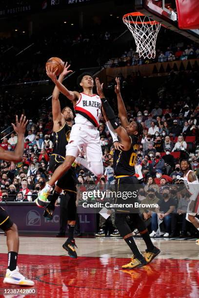 Anfernee Simons of the Portland Trail Blazers drives to the basket during the game against the Golden State Warriors on February 24, 2022 at the Moda...