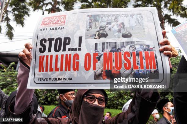 Group of Indonesian Muslims take part in a protest in front of the Indian embassy in Jakarta on February 25 demanding the Indian government to give...