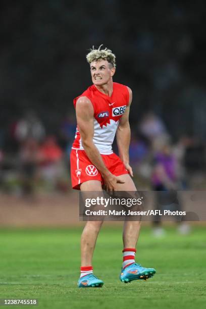 Chad Warner of the Swans grabs his leg during an AFL practice match between the Sydney Swans and the GWS Giants at Lavington Sports Ground on...