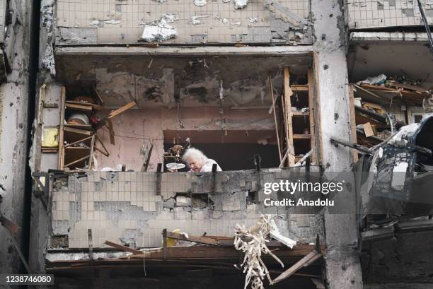 An elderly woman is seen amid rubbles after a missile struck a residential building during Russiaâs military intervention in left bank Kyiv, Ukraine...