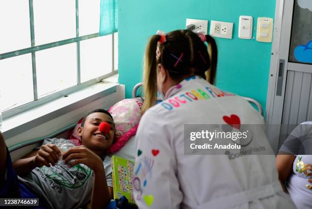 Medical doctors Leslie and Douglas who are in charge of laughter therapy in the general pediatrics section of Valle University Hospital try to bring...