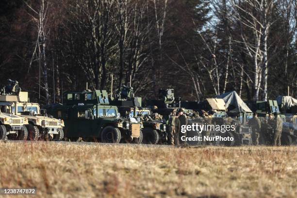 Soldiers of the 82nd Airborne Division and military vehicles are seen at the temporary military base for U.S. Troops established at the Arlamow...