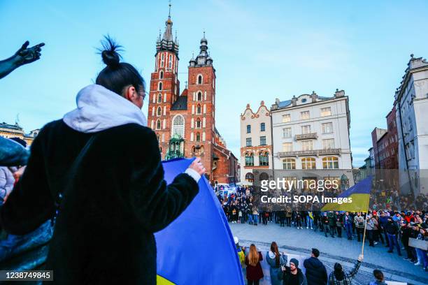 Protesters hold flags and gather during the protest. In response to Russian invasion of Ukraine, members of the Ukrainian community and supportive...