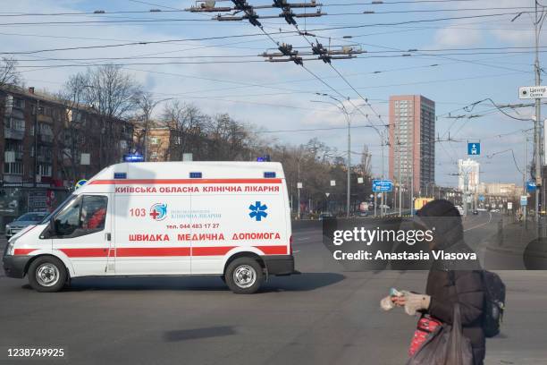 An ambulance drives past an empty street on February 25, 2022 in Kyiv, Ukraine. Yesterday, Russia began a large-scale attack on Ukraine, with Russian...