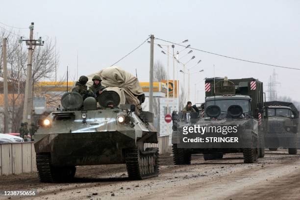 Russian army military vehicles are seen in Armyansk, Crimea, on February 25, 2022. - Ukrainian forces fought off Russian invaders in the streets of...