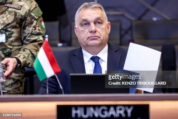 Hungary's Prime Minister Viktor Orban attends a NATO video summit on Russia's invasion of the Ukraine at the NATO headquarters in Brussels on...
