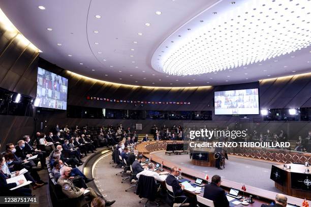 Secretary General Jens Stoltenberg delivers the opening remarks during a NATO video summit on Russia's invasion of Ukraine at NATO headquarters in...