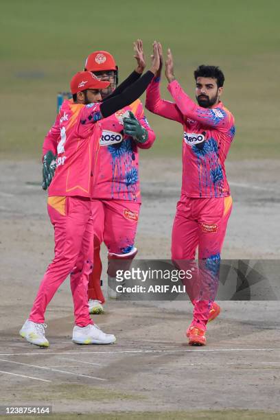 Islamabad United Shadab Khan celebrates the wicket of Lahore Qalandars' Kamran Ghulam during the Pakistan Super League Twenty20 eliminator 2 cricket...