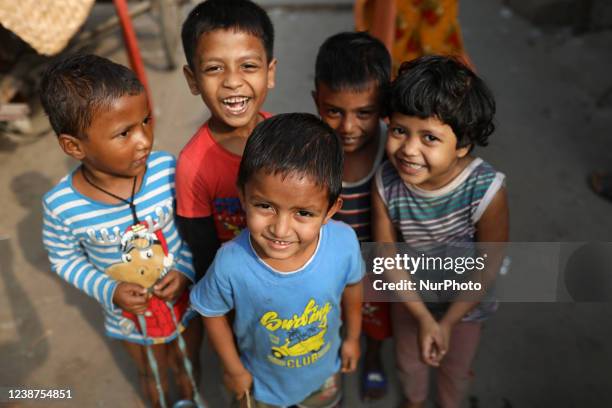 Children are seen in a slum area Dhaka, Bangladesh, on February 2022