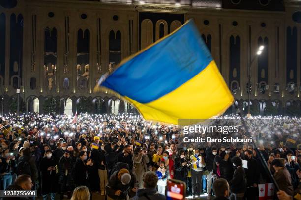 People gather for a rally in support of Ukraine in front of parliament, protesting the war in Ukraine and demanding the Georgian Prime Minister,...