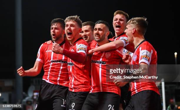 Derry , United Kingdom - 25 February 2022; Will Patching, left, celebrates with Derry City team-mates after scoring their side's first goal during...