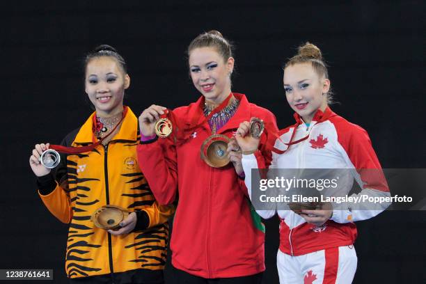 Gold medalist Francesca Jones of Wales alongside silver medalist Wong Poh San of Malaysia and bronze medalist Patricia Bezzoubenko of Canada...