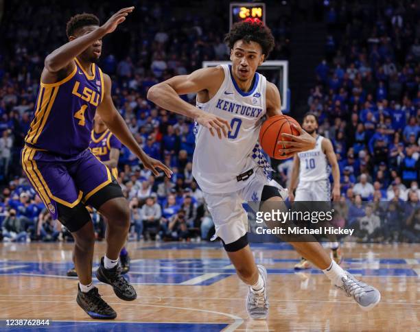 Jacob Toppin of the Kentucky Wildcats dribbles against Darius Days of the LSU Tigers at Rupp Arena on February 23, 2022 in Lexington, Kentucky.