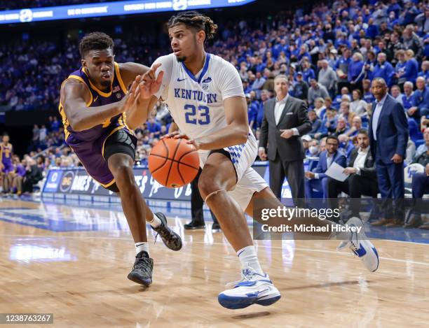 Bryce Hopkins of the Kentucky Wildcats drives to the basket against Darius Days of the LSU Tigers at Rupp Arena on February 23, 2022 in Lexington,...