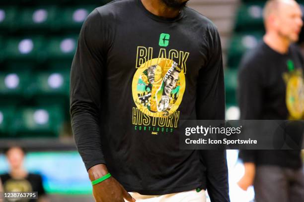 Charlotte 49ers player wears a Black History Month shirt during warm ups before a basketball game between the Charlotte 49ers and the Florida...