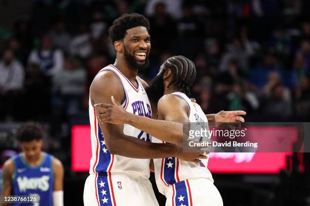 Joel Embiid and James Harden of the Philadelphia 76ers celebrate after Harden drew a foul against Karl-Anthony Towns of the Minnesota Timberwolves in...