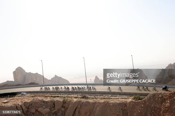 Riders compete during stage 7 of the United Arab Emirates cycling tour, from Al Jahili Fort to Jebel Hafeet, on February 26, 2022.