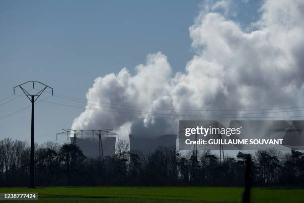 Steam rises from the cooling towers of a nuclear plant at Saint Laurent des Eaux, central France on February 26, 2022