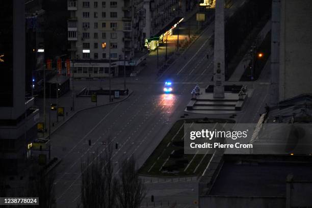 Police vehicle is seen patroling the streets as a curfew has been imposed from Saturday 5 PM to Monday 8 AM local time on February 26, 2022 in Kyiv,...