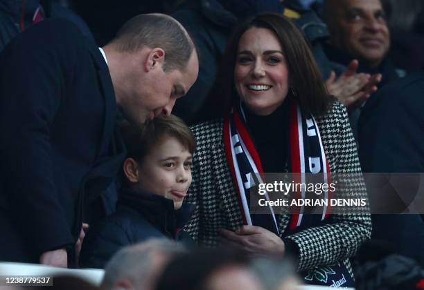 Britain's Prince William, Duke of Cambridge, , Britain's Prince George of Cambridge and Britain's Catherine, Duchess of Cambridge, attend the Six...