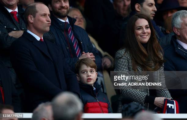 Britain's Prince William, Duke of Cambridge, , Britain's Prince George of Cambridge and Britain's Catherine, Duchess of Cambridge, attend the Six...