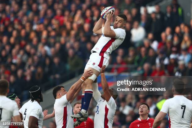 England's lock Charlie Ewels claims the ball in the line-out during the Six Nations international rugby union match between England and Wales at...