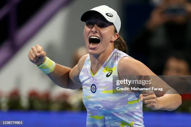 Iga Swiatek of Poland celebrates after winning against IAnett Kontaveit of Estonia during the Qatar TotalEnergies Open final at Khalifa International...