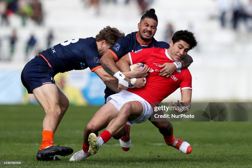 Barts Rugby Tomas Appleton of Portugal is tackled by Oliva Sialau and Bart... News ...