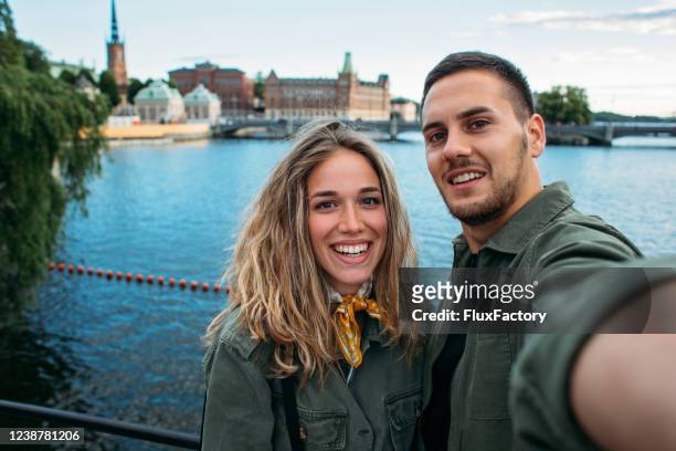 carefree couple visiting sweden - stockholm stock pictures, royalty-free photos & images