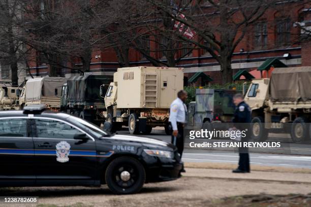 National Guard vehicles deploy on the National Mall in Washington, DC, on February 26 to provide security for expected truck convoys arriving in the...