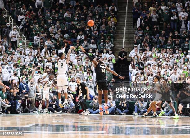 Tyson Walker of the Michigan State Spartans shoots the game winning three point shot against the Purdue Boilermakers at Breslin Center on February...