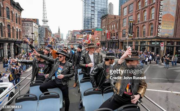 The Nashville Predators enjoy the rooftop buses ride down Broadway on their way to the 2022 Navy Federal Credit Union Stadium Series NHL game at...