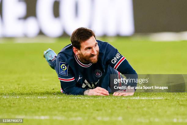 Lionel Messi of Paris Saint Germain lies injured during the Ligue 1 Uber Eats match between Paris Saint Germain and AS Saint-Etienne at Parc des...