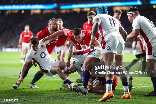 Gareth Thomas of Wales fends off Harry Randall and Kyle Sinckler of England during the Guinness Six Nations Rugby match between England and Wales at...