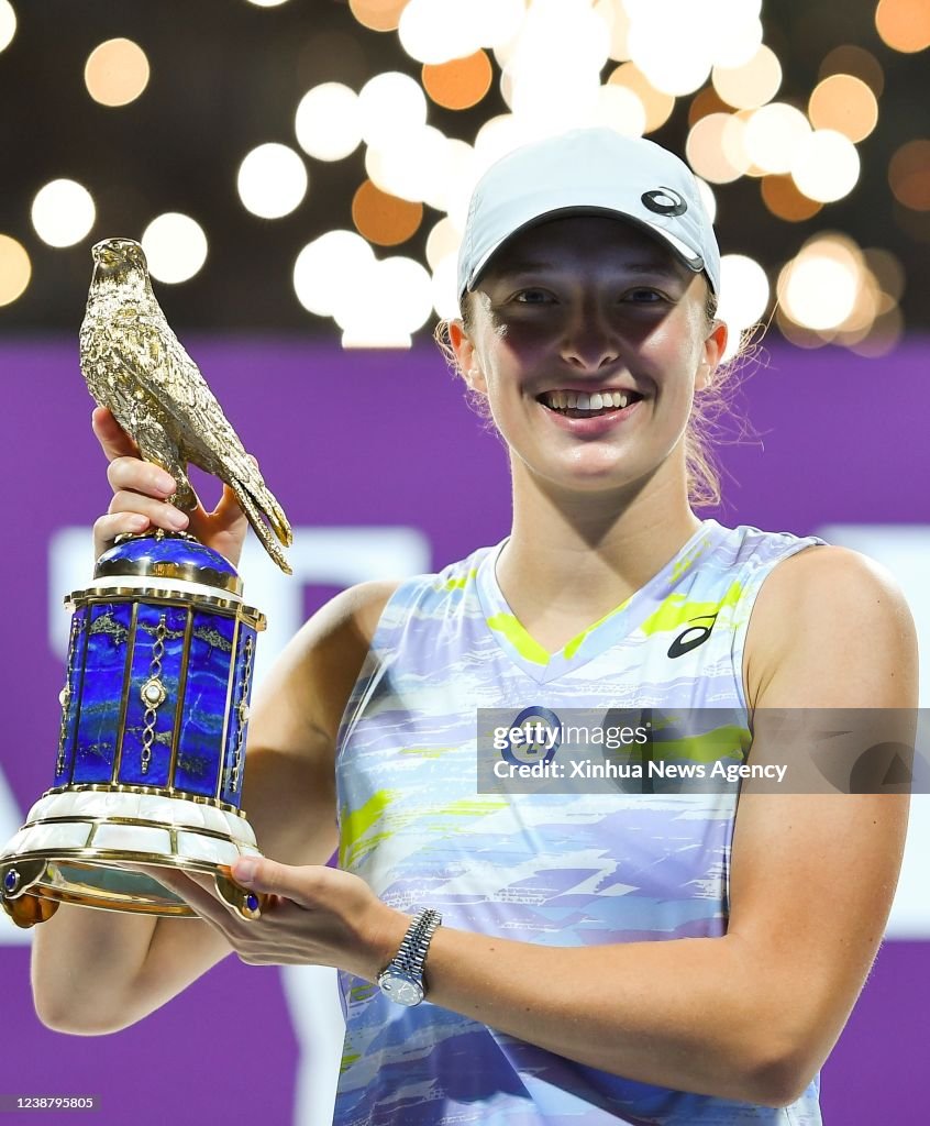 Iga Swiatek of Poland poses for photos during the award ceremony of